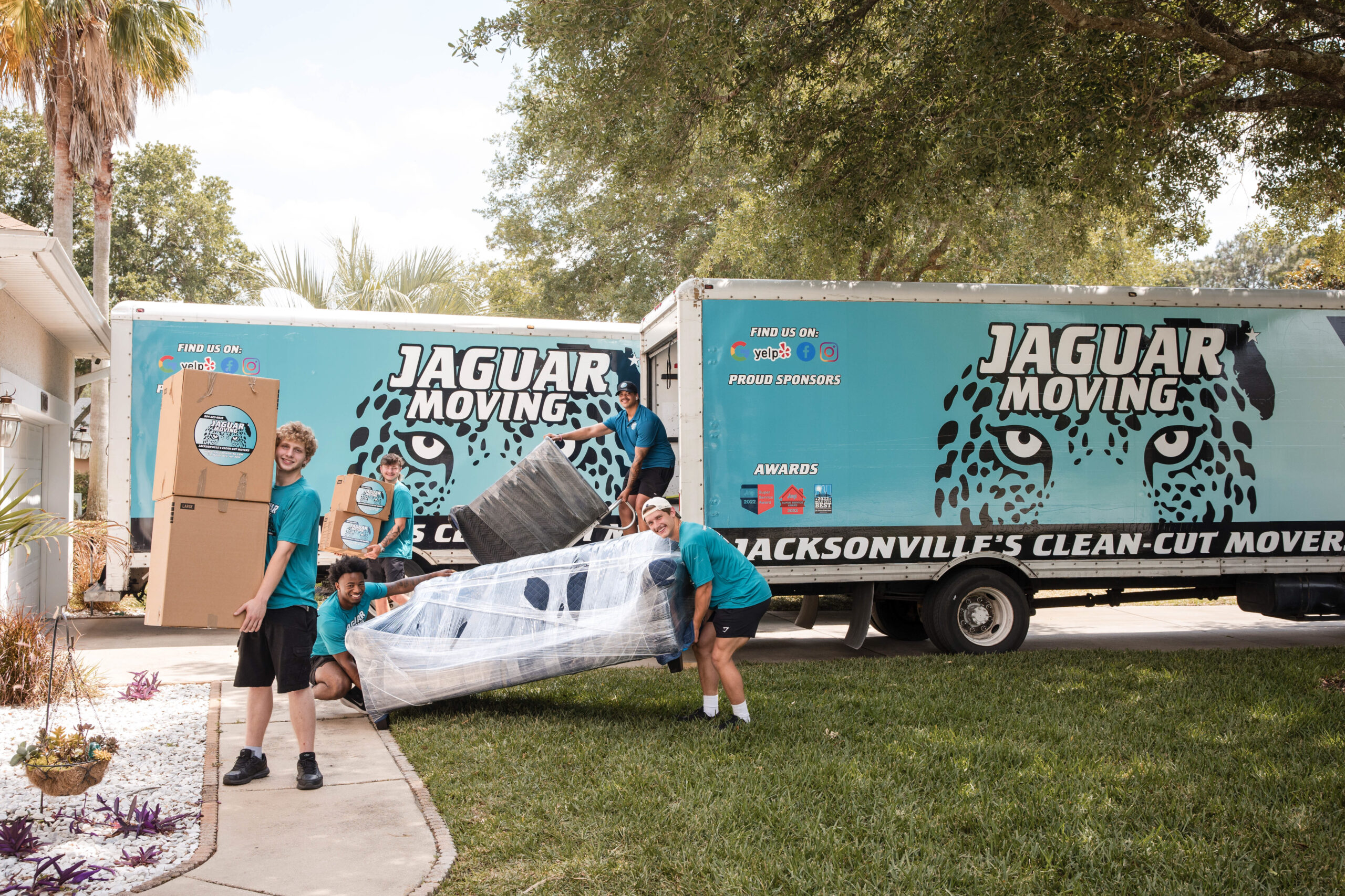 Professional movers from Jaguar Moving loading boxes into a moving truck in Jacksonville, FL