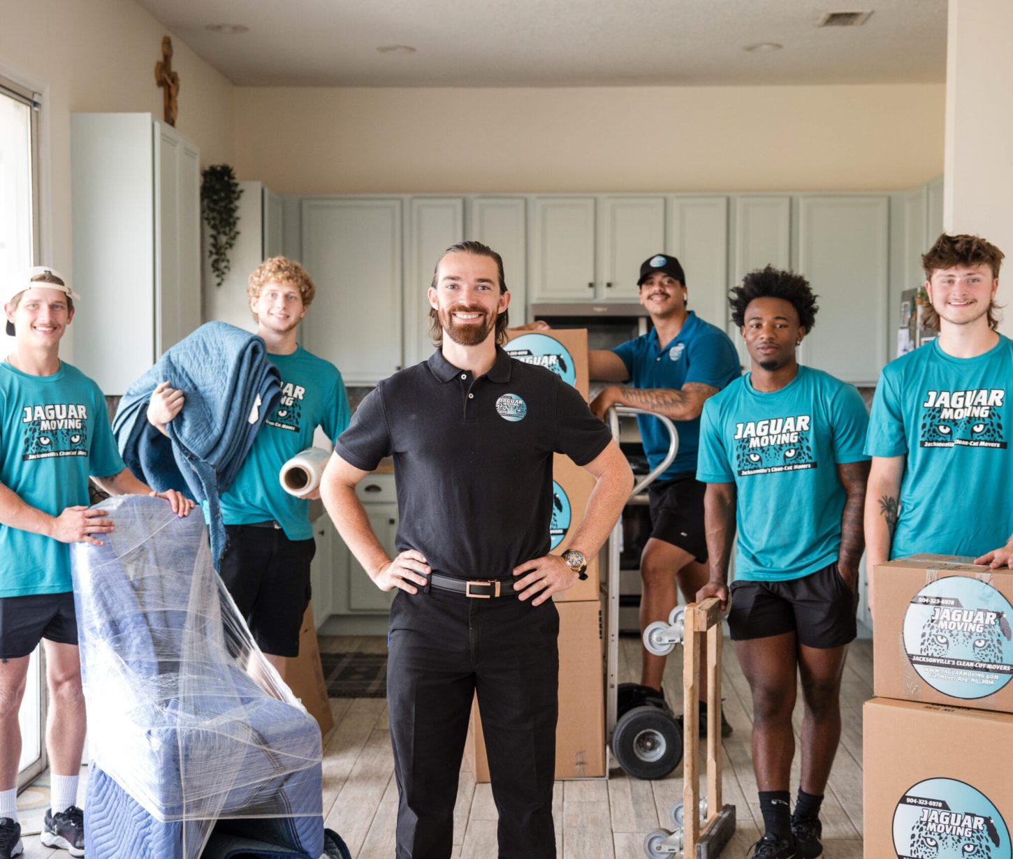 Jaguar Moving team carefully carrying furniture during a residential move in Jacksonville, FL